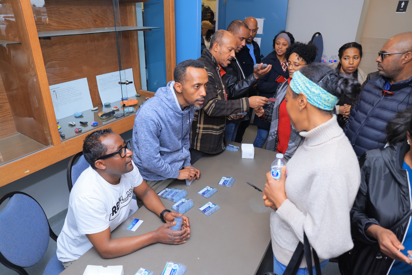 Members collect their membership cards