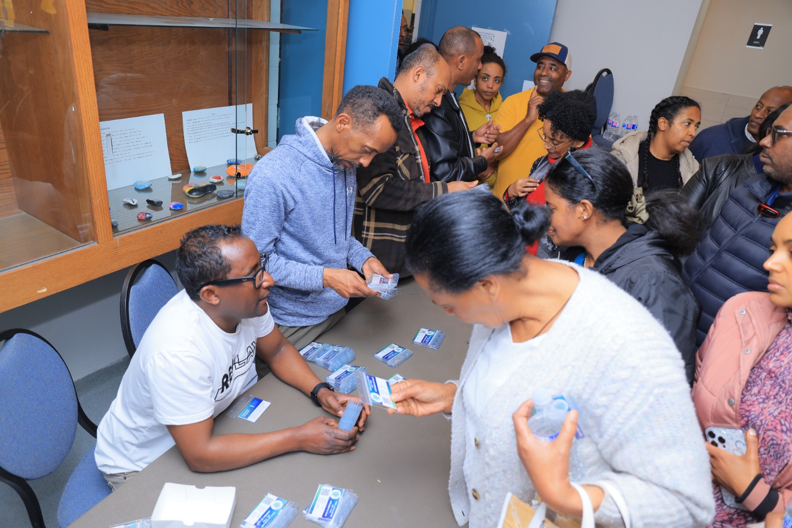 Distributing membership cards to attendees