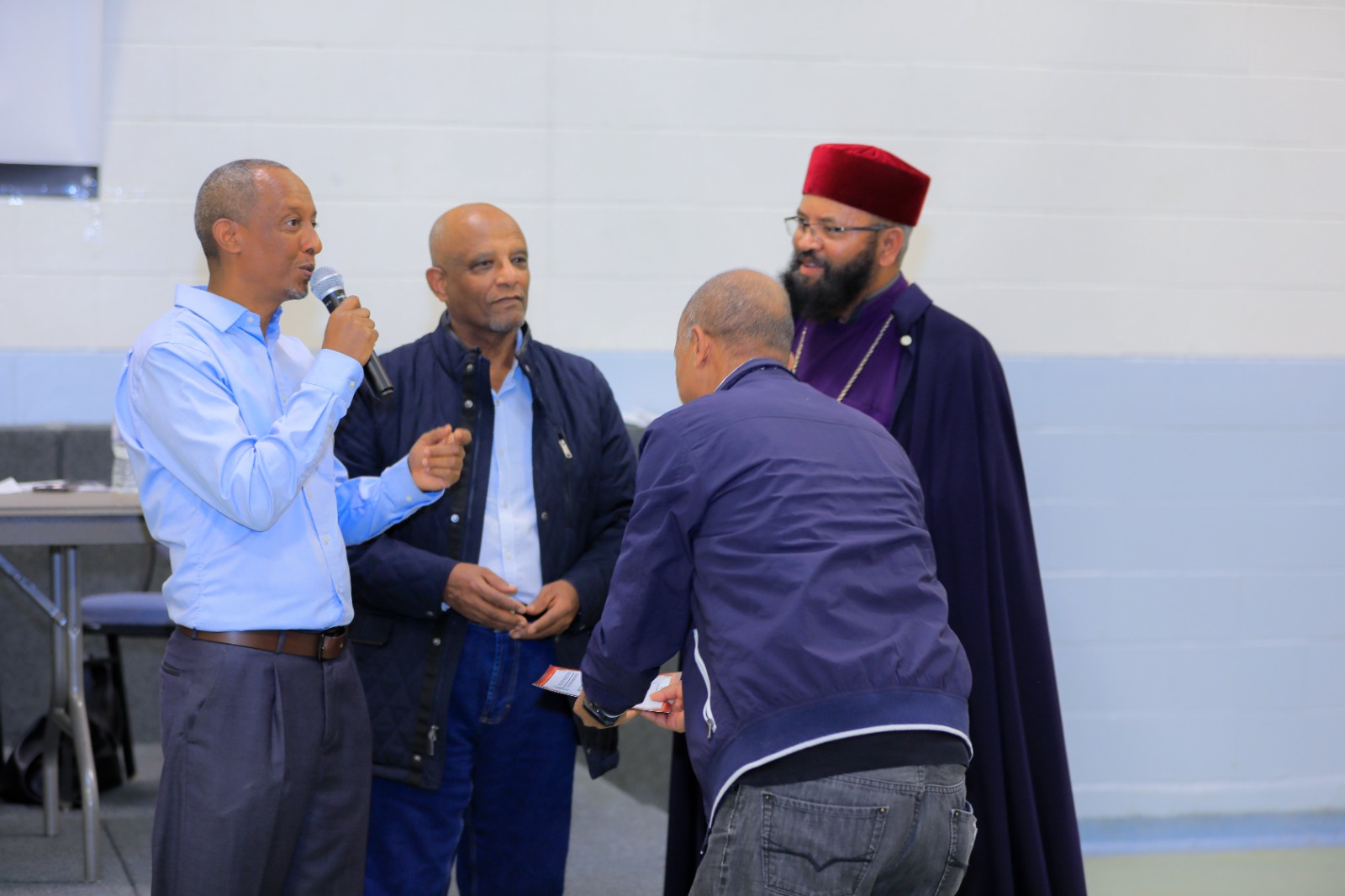 Committee members engage with attendees