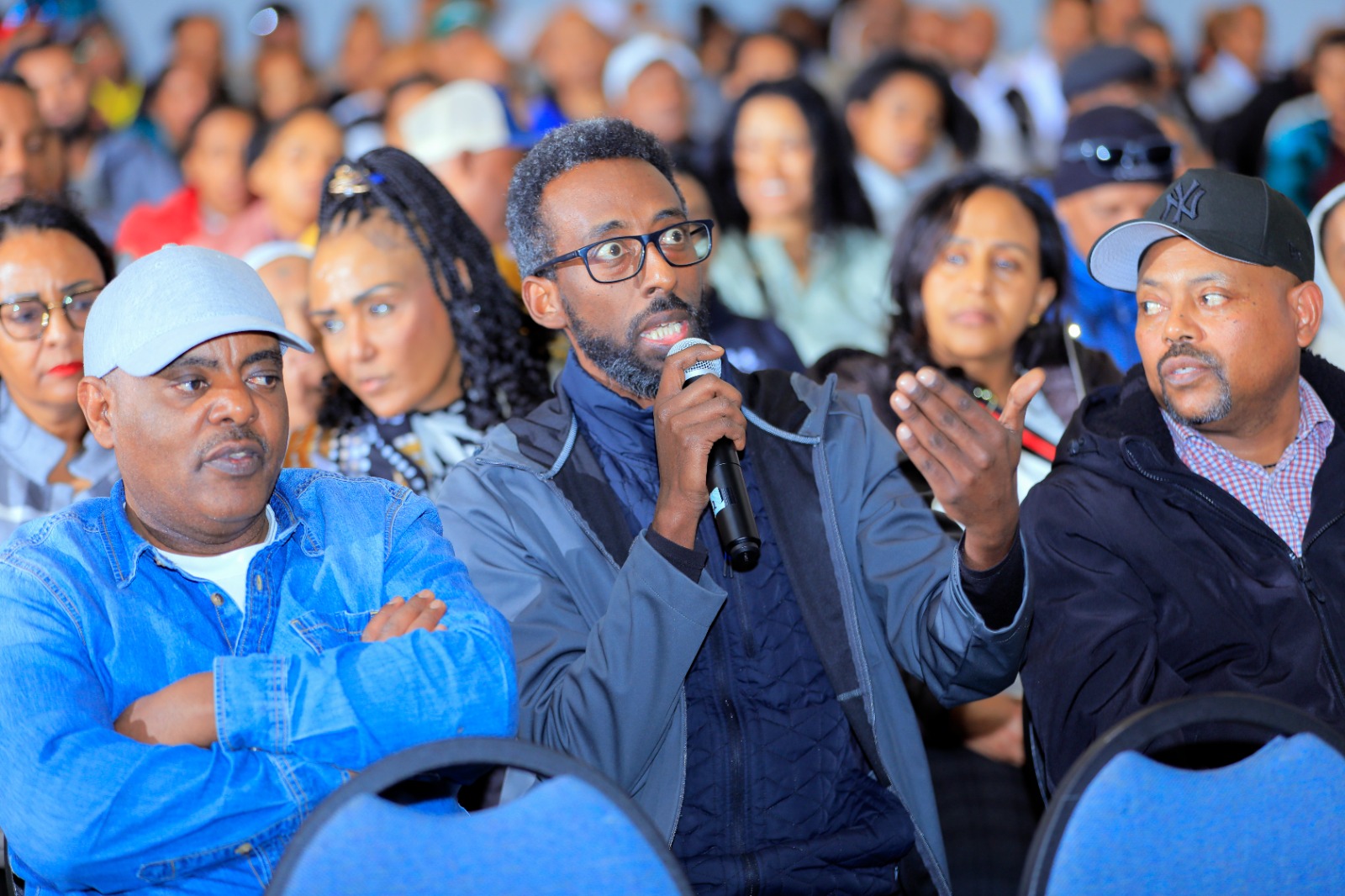 An attendee shares a question with the committee