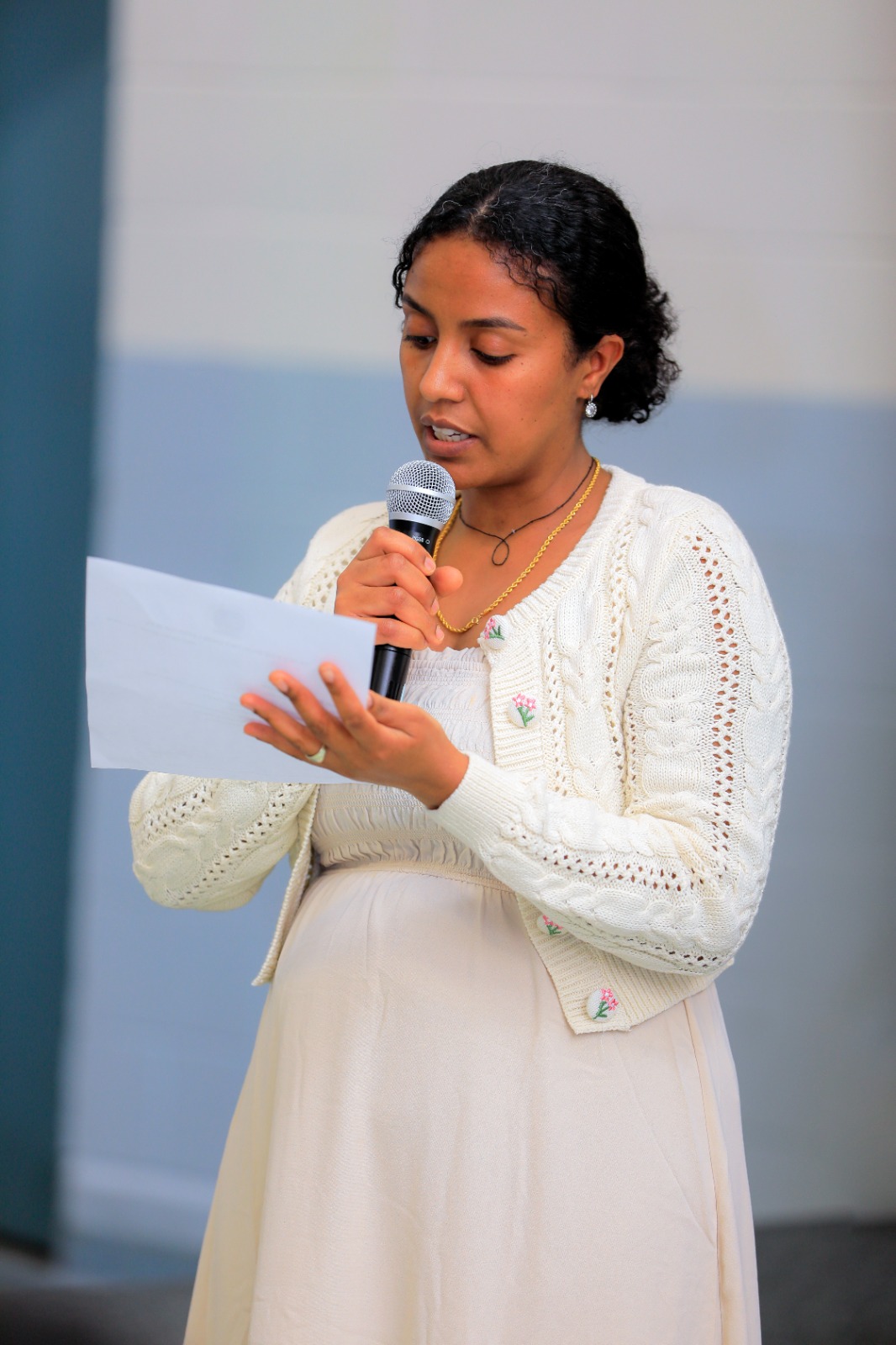 A member reads a statement to the gathering