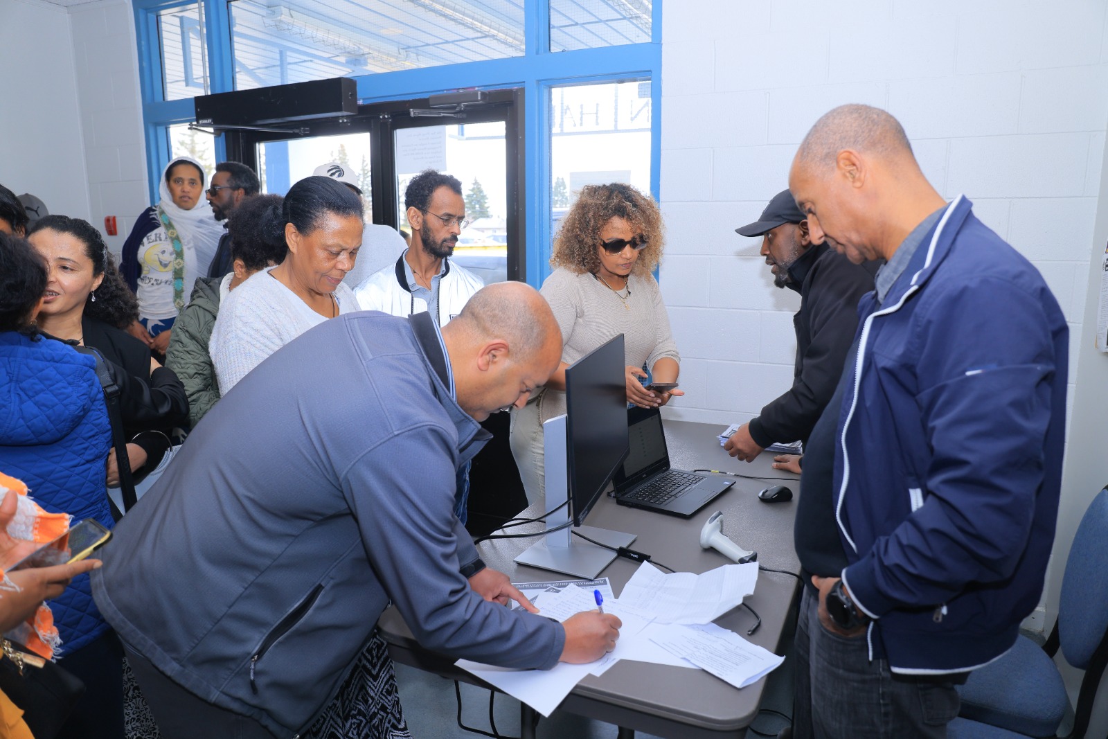 Signing in at the registration desk