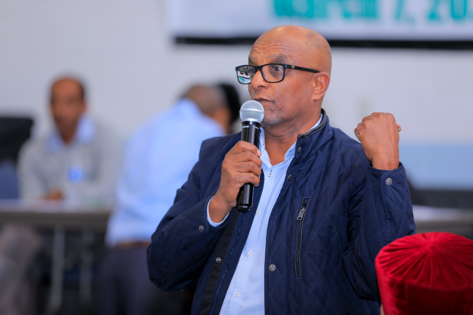 A member speaks passionately during discussion